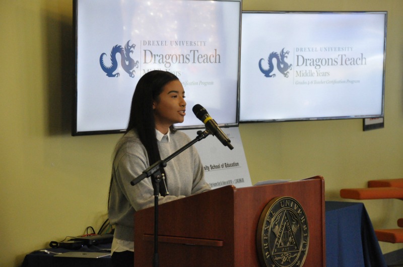 Aja Sor speaks at a press conference announcing a $1.2 million grant for the DragonsTeach Middle Years program.